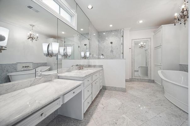 Bathroom, Chandelier, Dual Sink Vanities, Free Standing Baths, Glass Shower, Interior, Marble, Marble Walls, Recessed Lighting