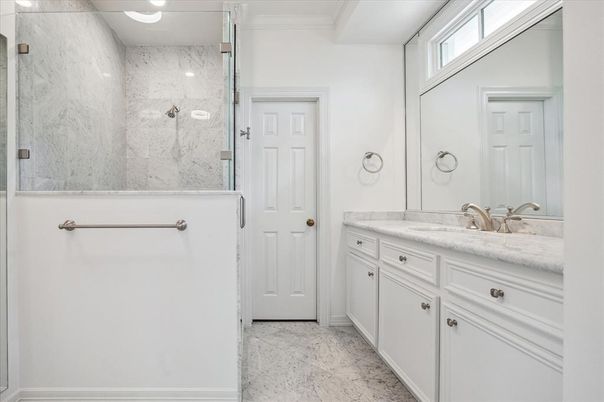 Bathroom, Dual Sink Vanities, Glass Shower, Interior, Marble, Marble Walls, Recessed Lighting