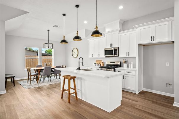 Dining room, Interior, Kitchen, Pendant Lights, Recessed Lighting, Stainless Steel Appliances, Wood Texture Flooring