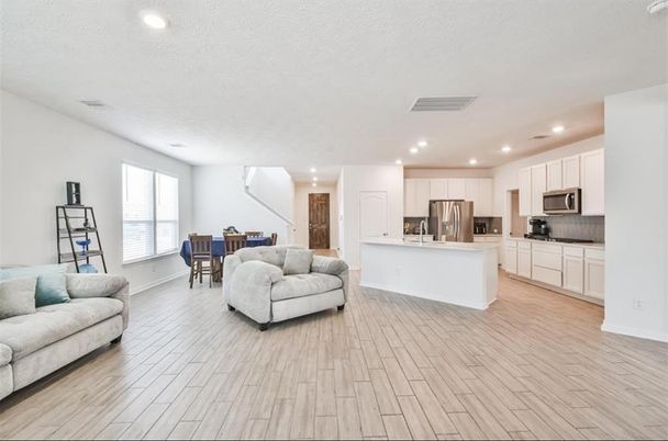Dining room, Interior, Kitchen, Living room, Recessed Lighting, Stainless Steel Appliances, Wood Texture Flooring