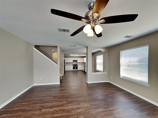 Empty room, Interior, Kitchen, Recessed Lighting, Stainless Steel Appliances, Wood Texture Flooring