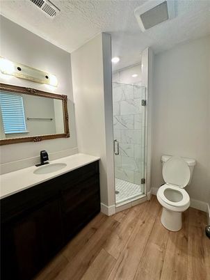 Bathroom, Glass Shower, Interior, Marble Walls, Recessed Lighting, Wood Texture Flooring
