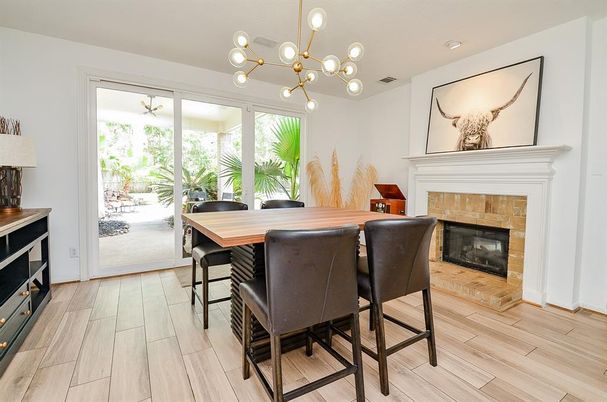 Dining room, Fireplace, Interior, Pendant Lights, Wood Texture Flooring