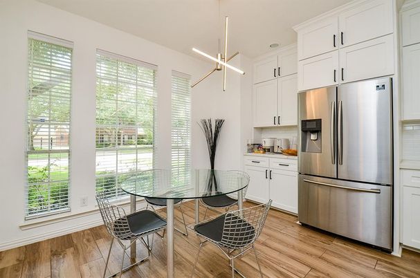Dining room, Interior, Kitchen, Pendant Lights, Recessed Lighting, Stainless Steel Appliances, Wood Texture Flooring