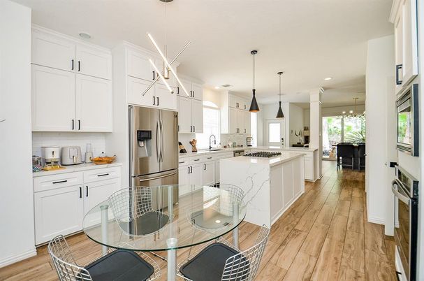 Dining room, Interior, Kitchen, Pendant Lights, Recessed Lighting, Stainless Steel Appliances, Wood Texture Flooring