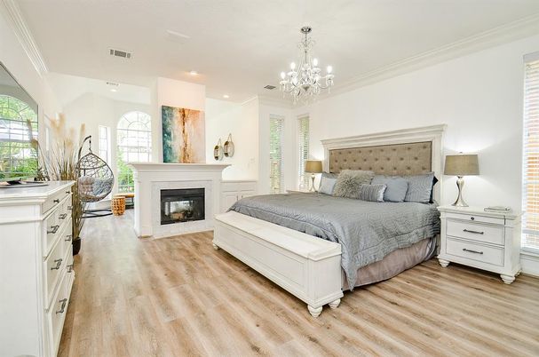 Bedroom, Chandelier, Fireplace, Interior, Recessed Lighting, Wood Texture Flooring