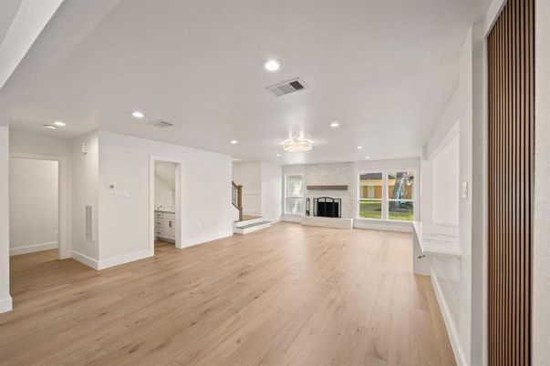Chandelier, Empty room, Fireplace, Interior, Recessed Lighting, Wood Texture Flooring