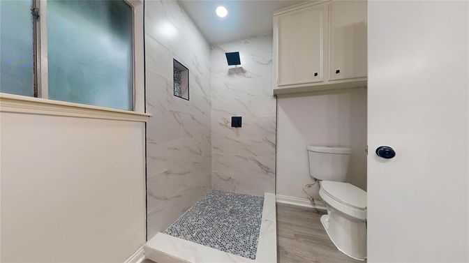 Bathroom, Glass Shower, Interior, Marble Walls, Recessed Lighting, Wood Texture Flooring