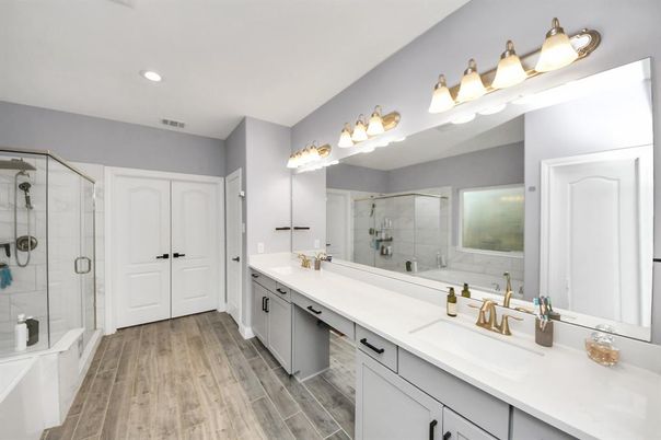 Bathroom, Dual Sink Vanities, Glass Shower, Interior, Recessed Lighting, Wood Texture Flooring