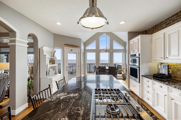 Dining room, Interior, Kitchen, Recessed Lighting, Stainless Steel Appliances, Water, Wood Texture Flooring