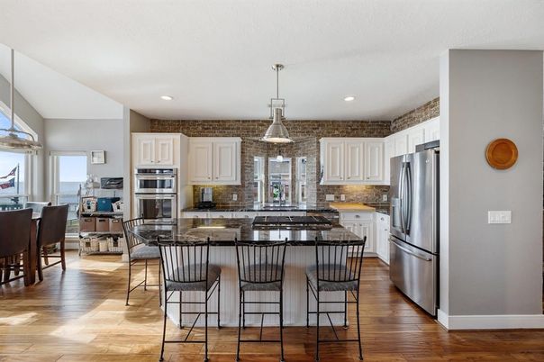 Dining room, Interior, Kitchen, Pendant Lights, Recessed Lighting, Stainless Steel Appliances, Stone Walls, Wood Texture Flooring