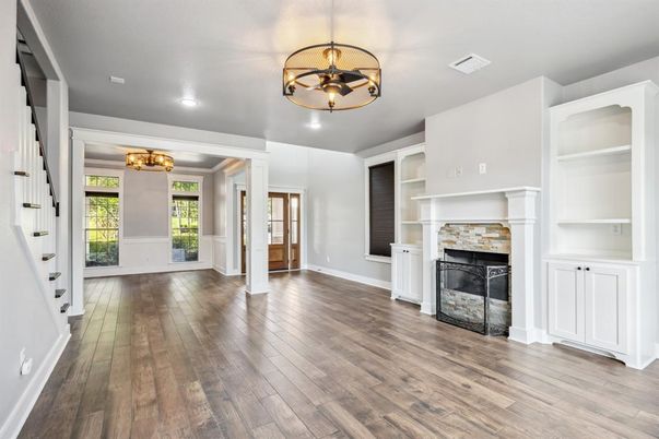 Chandelier, Empty room, Fireplace, Interior, Recessed Lighting, Wood Texture Flooring