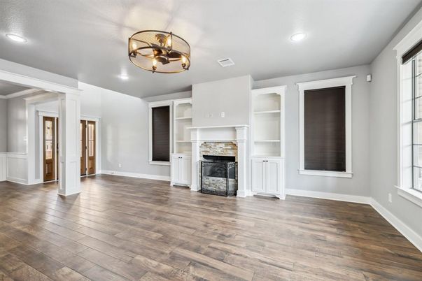 Chandelier, Empty room, Fireplace, Interior, Recessed Lighting, Wood Texture Flooring