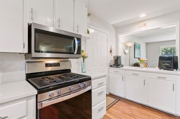 Interior, Kitchen, Recessed Lighting, Stainless Steel Appliances, Wood Texture Flooring