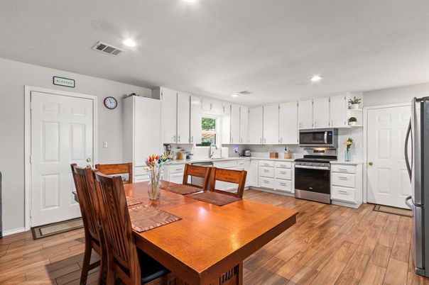 Dining room, Interior, Kitchen, Recessed Lighting, Stainless Steel Appliances, Wood Texture Flooring