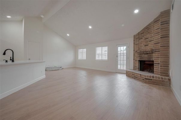 Empty room, Fireplace, Interior, Recessed Lighting, Stone Walls, Wood Texture Flooring
