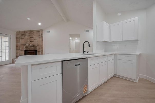 Fireplace, Interior, Kitchen, Recessed Lighting, Stone Walls, Wood Texture Flooring