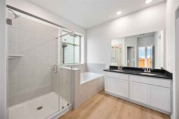 Bathroom, Dual Sink Vanities, Glass Shower, Interior, Recessed Lighting, Wood Texture Flooring