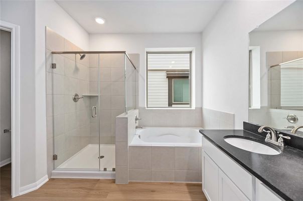 Bathroom, Dual Sink Vanities, Glass Shower, Interior, Recessed Lighting, Wood Texture Flooring
