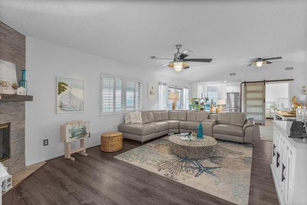 Dining room, Fireplace, Interior, Living room, Recessed Lighting, Wood Texture Flooring