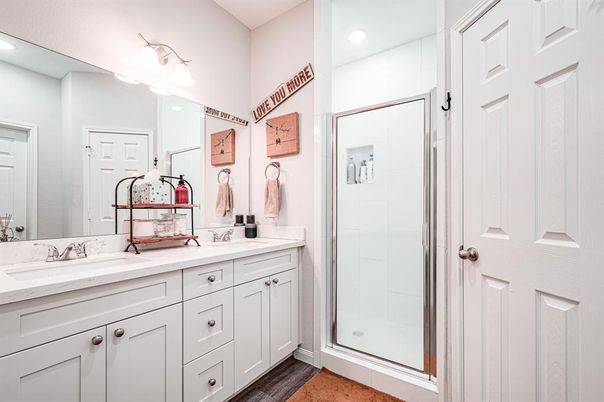 Bathroom, Dual Sink Vanities, Glass Shower, Interior, Recessed Lighting, Wood Texture Flooring
