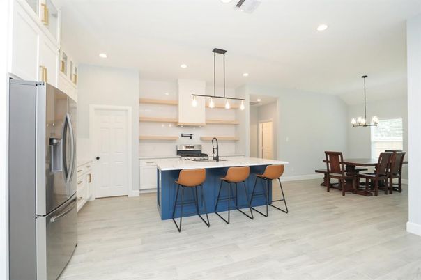 Chandelier, Dining room, Interior, Kitchen, Pendant Lights, Recessed Lighting, Stainless Steel Appliances, Wood Texture Flooring