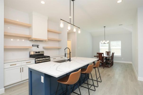 Chandelier, Dining room, Interior, Kitchen, Pendant Lights, Recessed Lighting, Stainless Steel Appliances, Wood Texture Flooring