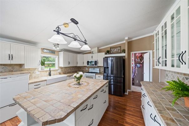 Interior, Kitchen, Pendant Lights, Tile Countertops, Wood Texture Flooring