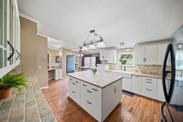Interior, Kitchen, Pendant Lights, Tile Countertops, Wood Texture Flooring