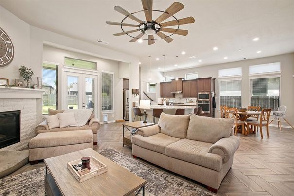 Dining room, Fireplace, Interior, Kitchen, Living room, Pendant Lights, Recessed Lighting, Stainless Steel Appliances, Wood Texture Flooring