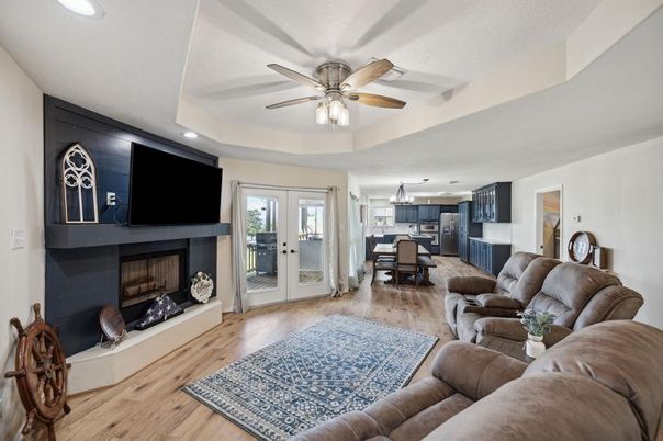 Chandelier, Dining room, Fireplace, Interior, Kitchen, Living room, Pendant Lights, Recessed Lighting, Wood Texture Flooring