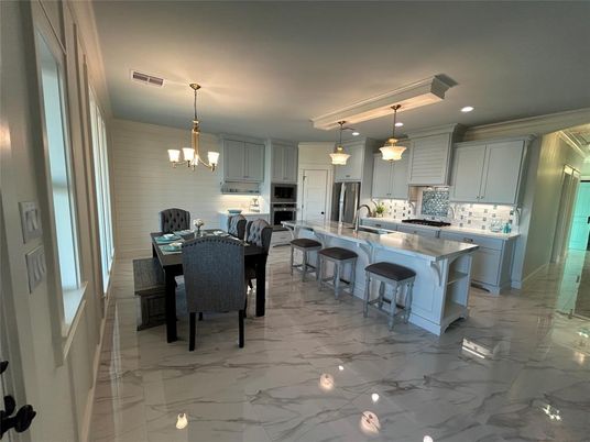 Chandelier, Dining room, Interior, Kitchen, Marble, Pendant Lights, Recessed Lighting, Stainless Steel Appliances
