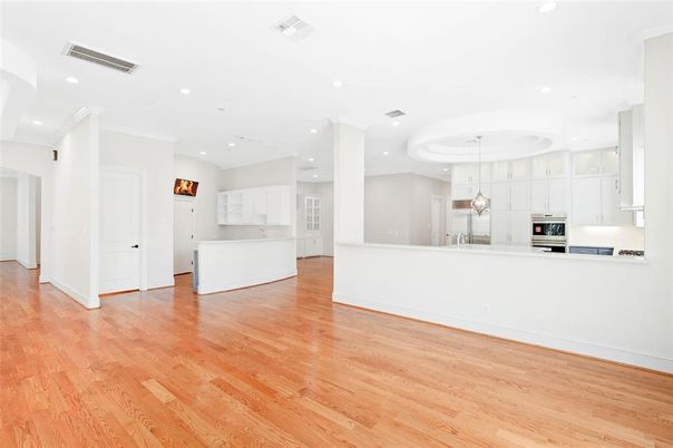 Empty room, Interior, Kitchen, Pendant Lights, Recessed Lighting, Stainless Steel Appliances, Wood Texture Flooring