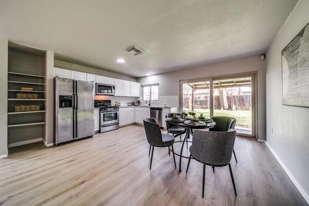 Dining room, Interior, Kitchen, Recessed Lighting, Stainless Steel Appliances, Wood Texture Flooring