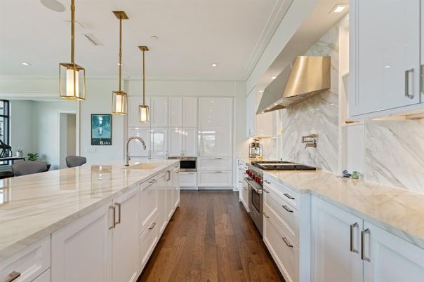 Interior, Kitchen, Marble Walls, Pendant Lights, Recessed Lighting, Stainless Steel Appliances, Wood Texture Flooring
