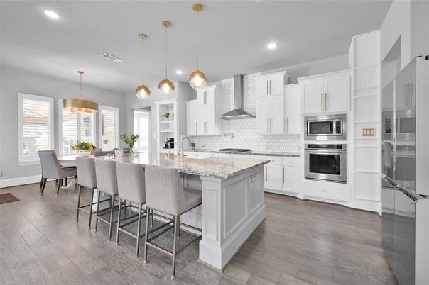 Dining room, Interior, Kitchen, Pendant Lights, Recessed Lighting, Stainless Steel Appliances, Wood Texture Flooring