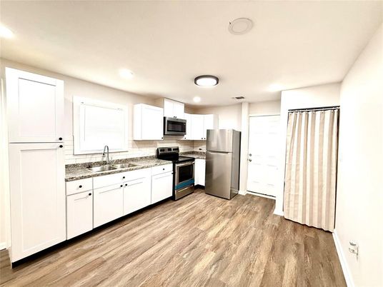 Interior, Kitchen, Recessed Lighting, Stainless Steel Appliances, Wood Texture Flooring