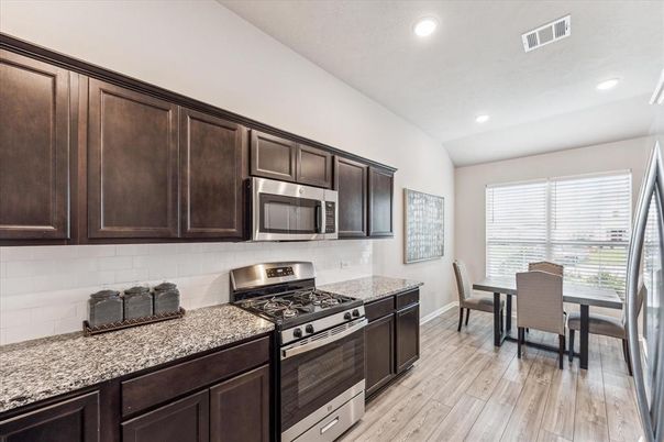 Dining room, Interior, Kitchen, Recessed Lighting, Stainless Steel Appliances, Wood Texture Flooring