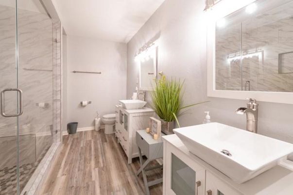 Bathroom, Dual Sink Vanities, Glass Shower, Interior, Marble Walls, Wood Texture Flooring