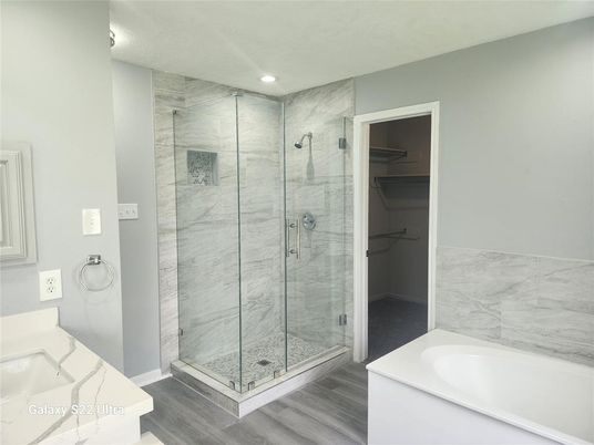Bathroom, Glass Shower, Interior, Marble Walls, Recessed Lighting, Wood Texture Flooring