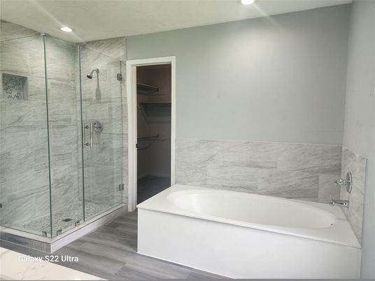 Bathroom, Glass Shower, Interior, Marble Walls, Recessed Lighting, Wood Texture Flooring