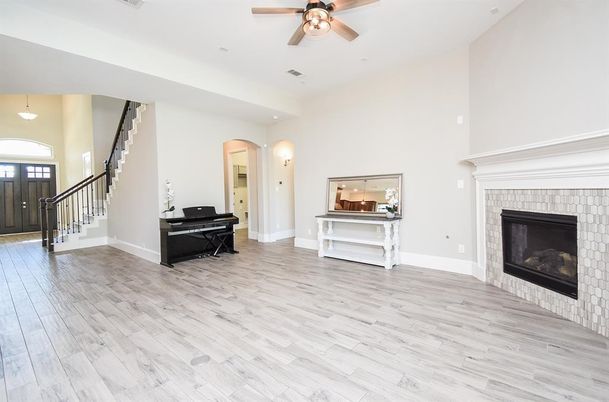 Fireplace, Interior, Pendant Lights, Piano, Recessed Lighting, Wood Texture Flooring