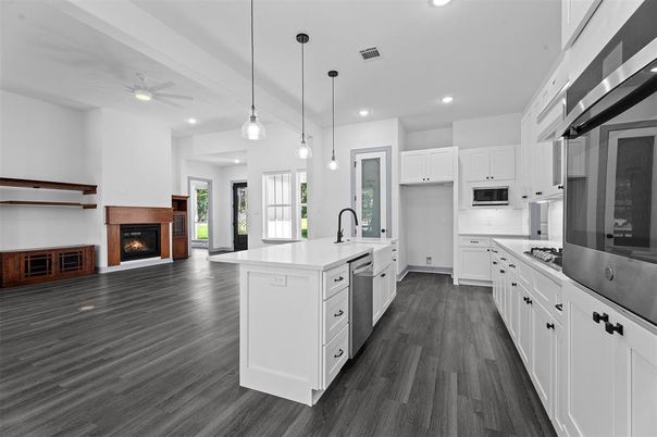 Fireplace, Interior, Kitchen, Pendant Lights, Recessed Lighting, Stainless Steel Appliances, Wood Texture Flooring