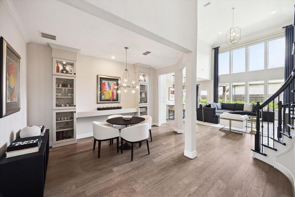 Dining room, Fireplace, Interior, Living room, Pendant Lights, Recessed Lighting, Wood Texture Flooring