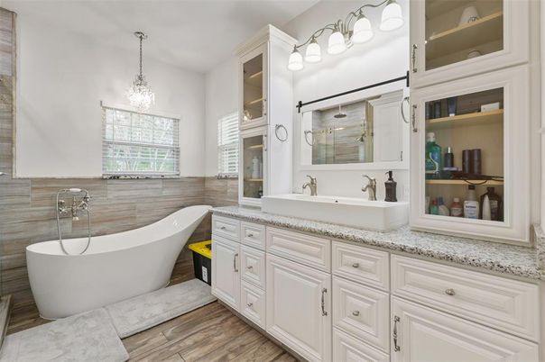 Bathroom, Chandelier, Dual Sink Vanities, Free Standing Baths, Interior, Pendant Lights, Wood Texture Flooring
