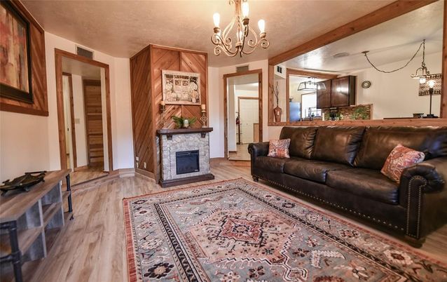 Chandelier, Fireplace, Interior, Living room, Wooden Beams, Wood Texture Flooring