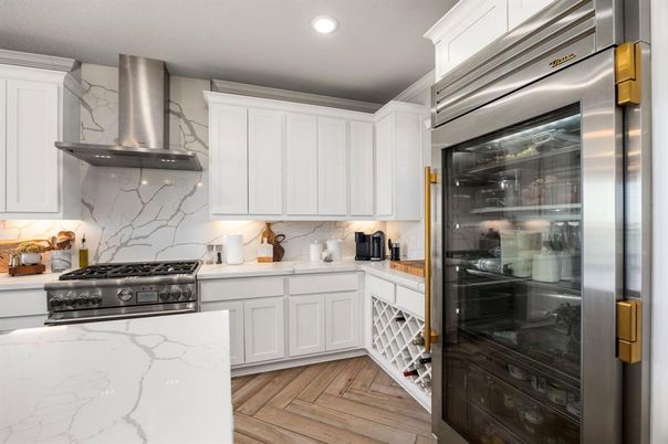 Interior, Kitchen, Marble Walls, Recessed Lighting, Stainless Steel Appliances, Wood Texture Flooring