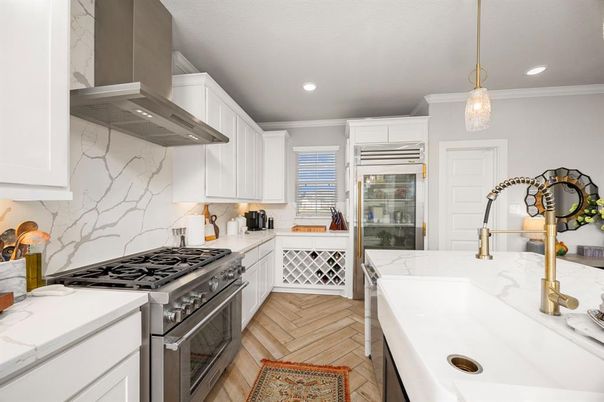 Interior, Kitchen, Marble Walls, Pendant Lights, Recessed Lighting, Stainless Steel Appliances, Wood Texture Flooring