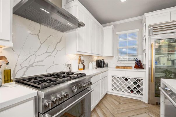 Interior, Kitchen, Marble Walls, Recessed Lighting, Stainless Steel Appliances, Wood Texture Flooring