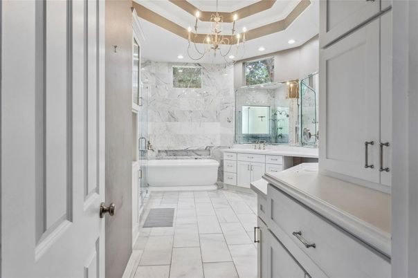 Bathroom, Chandelier, Dual Sink Vanities, Free Standing Baths, Interior, Marble, Marble Walls, Recessed Lighting